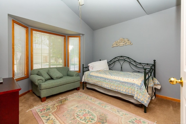 carpeted bedroom with vaulted ceiling and ceiling fan