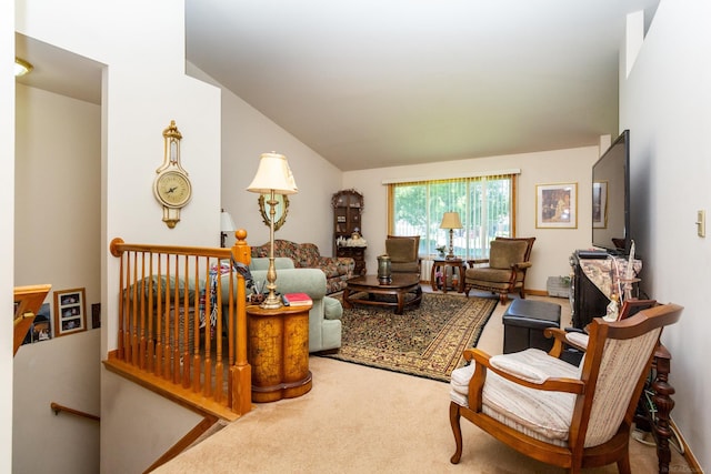 living room with carpet floors and vaulted ceiling