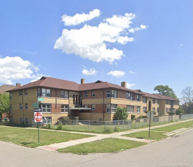 view of property featuring fence