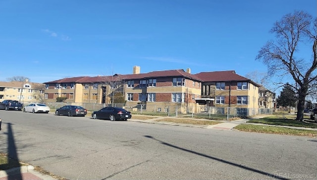 view of road with curbs, sidewalks, and a residential view