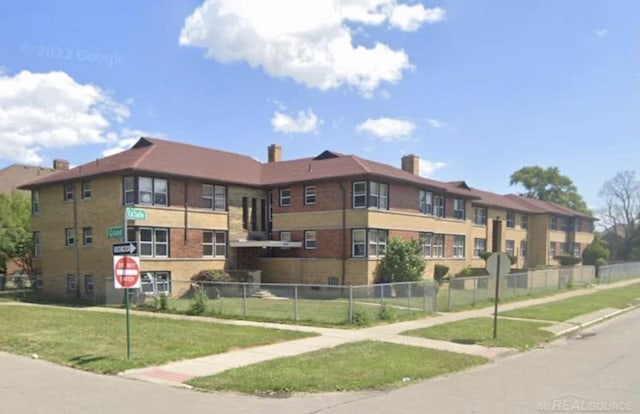 view of building exterior featuring fence