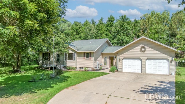 view of front of house featuring a garage and a front yard