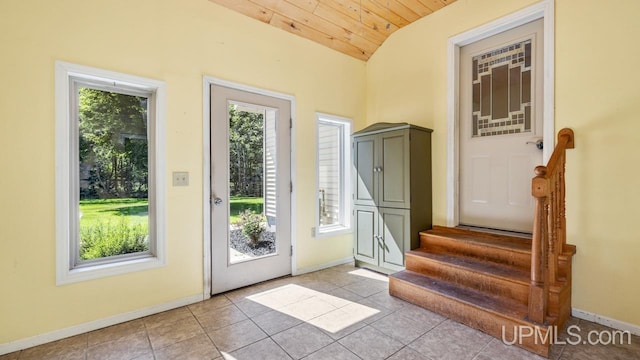 doorway featuring light tile patterned flooring, vaulted ceiling, and wood ceiling