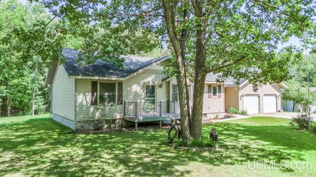 view of front of home with a garage and a front yard