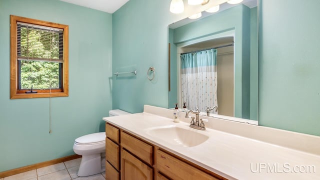 bathroom with tile patterned floors, toilet, and vanity