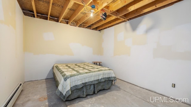 bedroom with a baseboard radiator and concrete floors