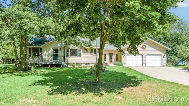 single story home with a garage and a front lawn