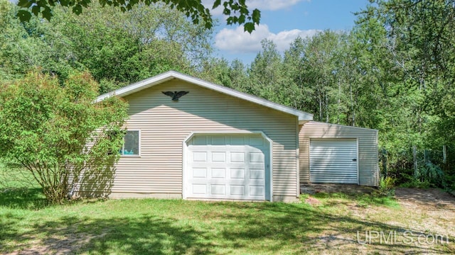 garage with a lawn