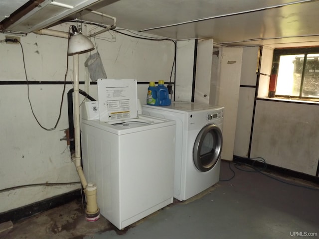 clothes washing area featuring washer and dryer