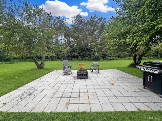 view of patio / terrace with a fire pit