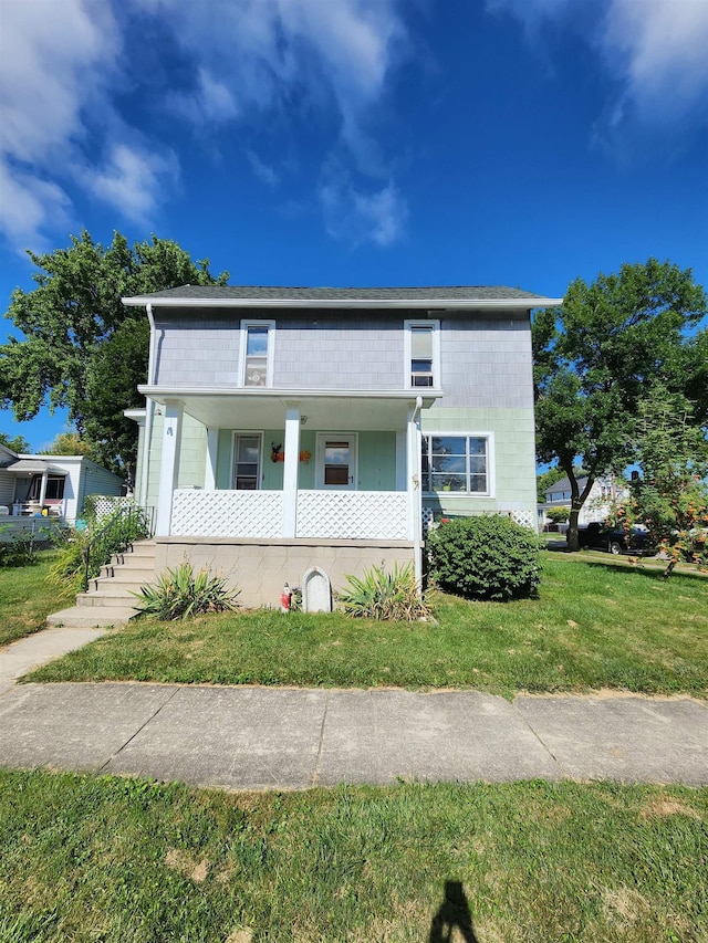view of front of house featuring a porch and a front lawn