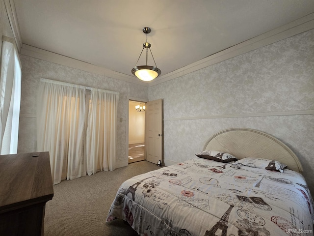 carpeted bedroom with wallpapered walls and crown molding