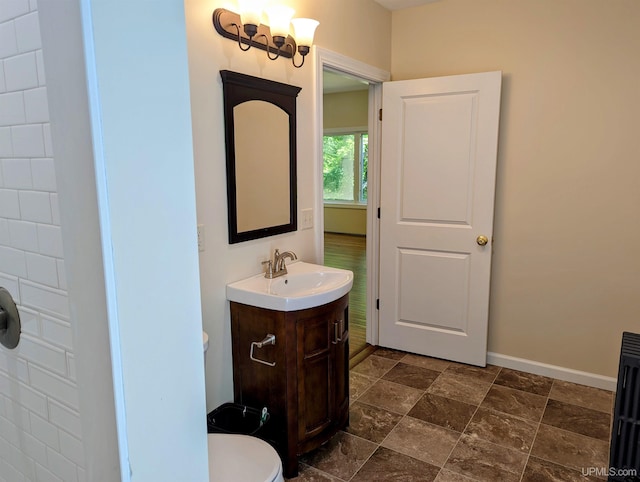 bathroom with tile patterned floors, vanity, and toilet