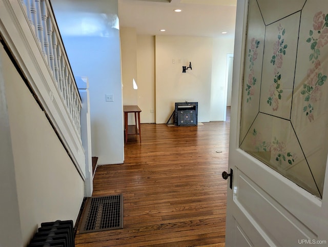 hall with dark hardwood / wood-style flooring