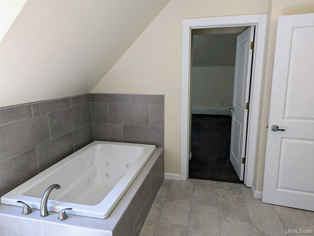 bathroom featuring baseboard heating, tile patterned floors, tiled bath, and vaulted ceiling