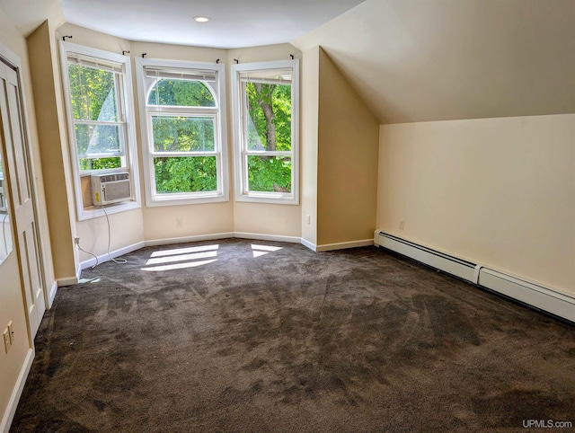 bonus room featuring dark colored carpet, lofted ceiling, cooling unit, and a baseboard radiator