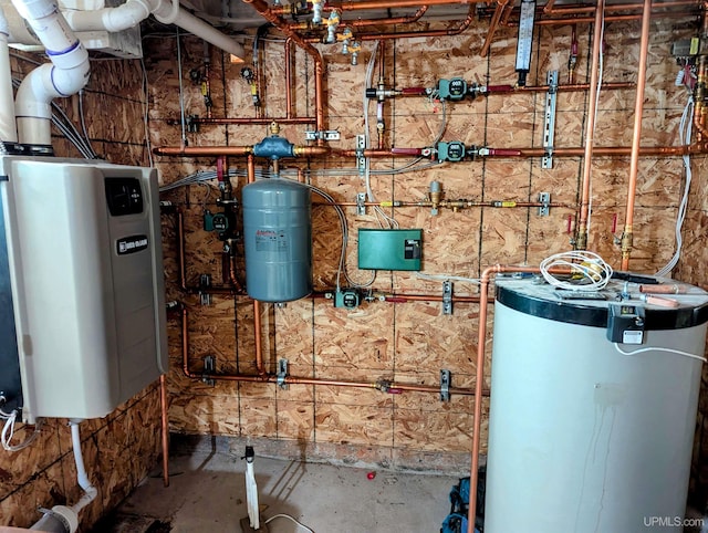 utility room with water heater and gas water heater