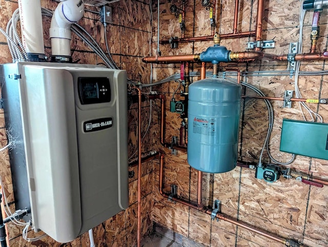 utility room with water heater