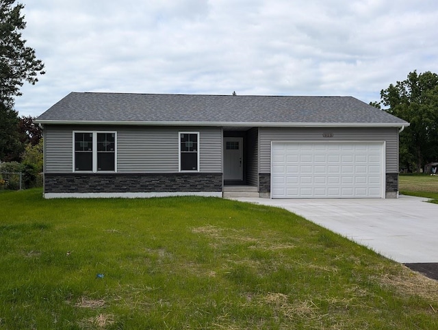 single story home with a front lawn and a garage