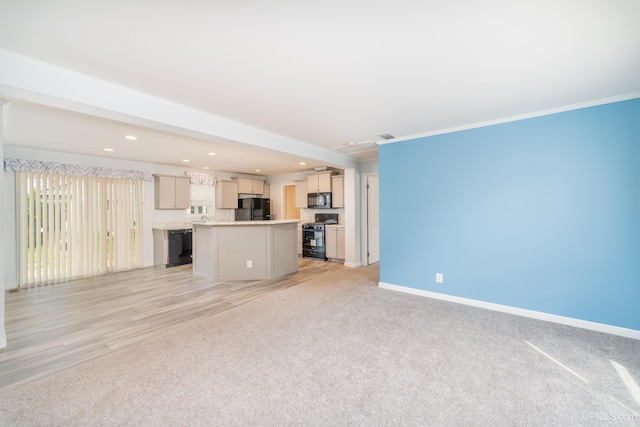 unfurnished living room featuring recessed lighting, baseboards, light carpet, and crown molding