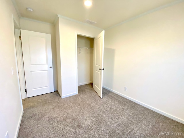 unfurnished bedroom featuring baseboards, carpet, a closet, and ornamental molding