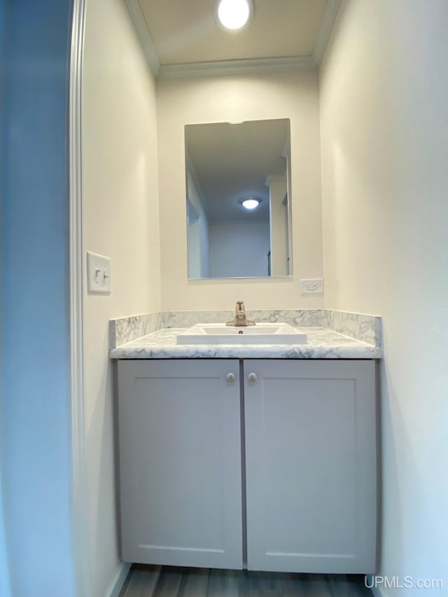 bathroom with vanity and crown molding