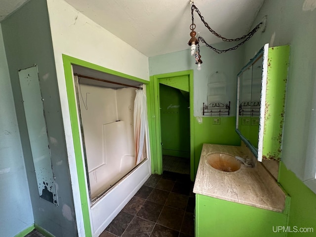 bathroom featuring vanity,  shower combination, and tile patterned flooring