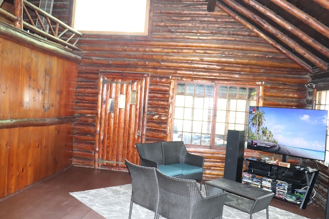 living area featuring high vaulted ceiling, hardwood / wood-style flooring, and log walls