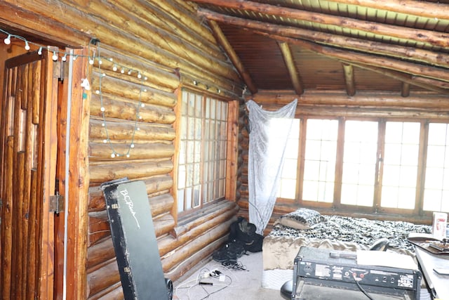 interior space with rustic walls, vaulted ceiling with beams, and wood ceiling