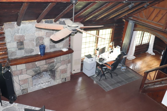 dining room featuring ceiling fan, vaulted ceiling with beams, and hardwood / wood-style flooring