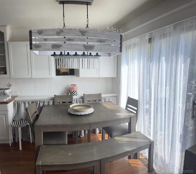 dining room with plenty of natural light and hardwood / wood-style flooring