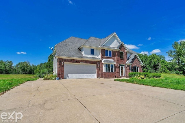 view of front facade with a garage and a front lawn