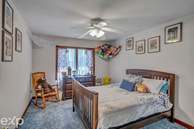 carpeted bedroom with ceiling fan