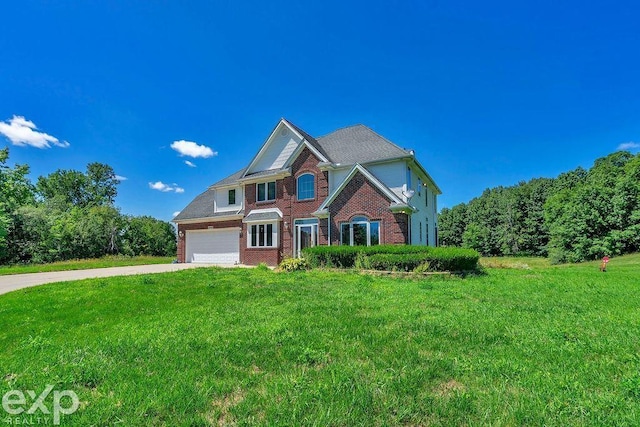 view of front of home featuring a garage and a front lawn