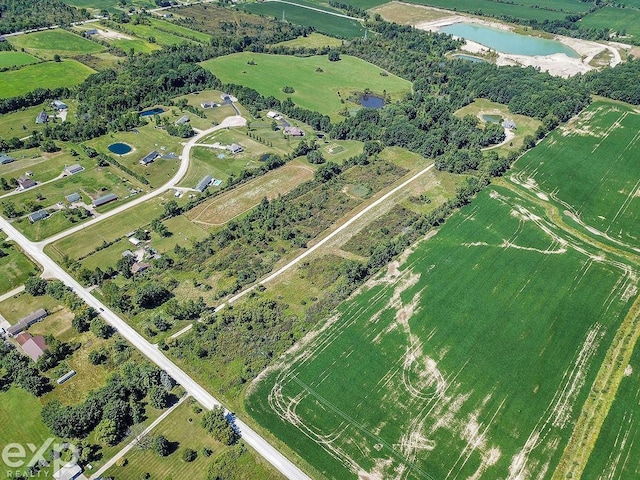 aerial view featuring a water view and a rural view