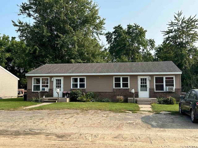 view of front of house featuring cooling unit