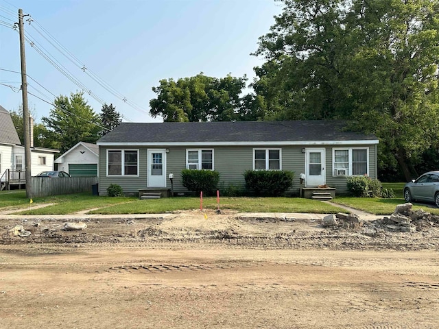 ranch-style home with a front lawn