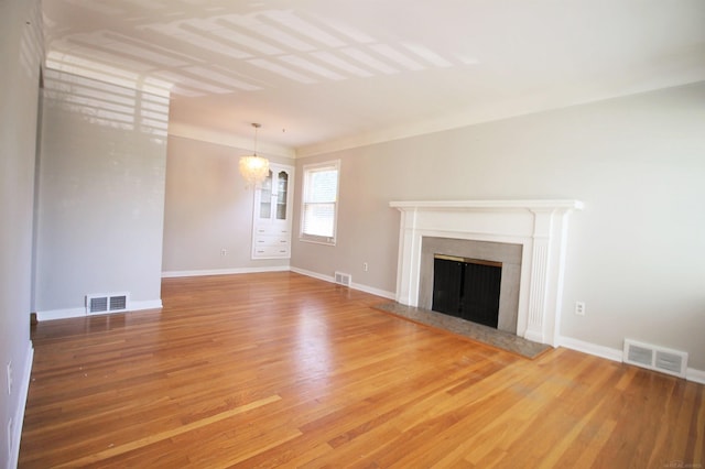 unfurnished living room featuring hardwood / wood-style flooring