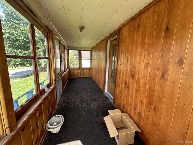 unfurnished sunroom featuring a wealth of natural light