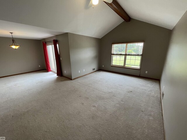 carpeted empty room featuring vaulted ceiling with beams and ceiling fan