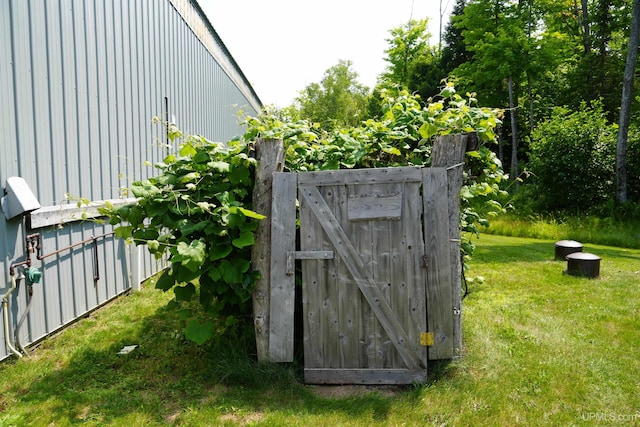 view of outbuilding with a yard