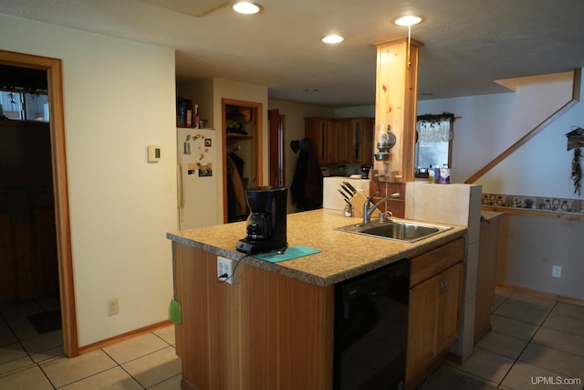 kitchen featuring sink, dishwasher, light tile patterned floors, and kitchen peninsula