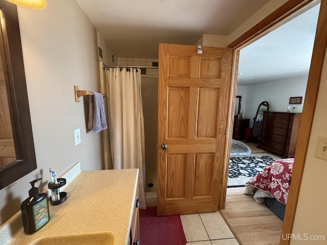 14998 N Superior Rd, Houghton, MI 49931 - bathroom featuring a stall shower and tile patterned floors