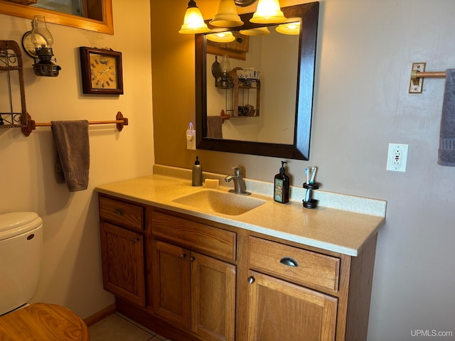 bathroom with toilet and vanity