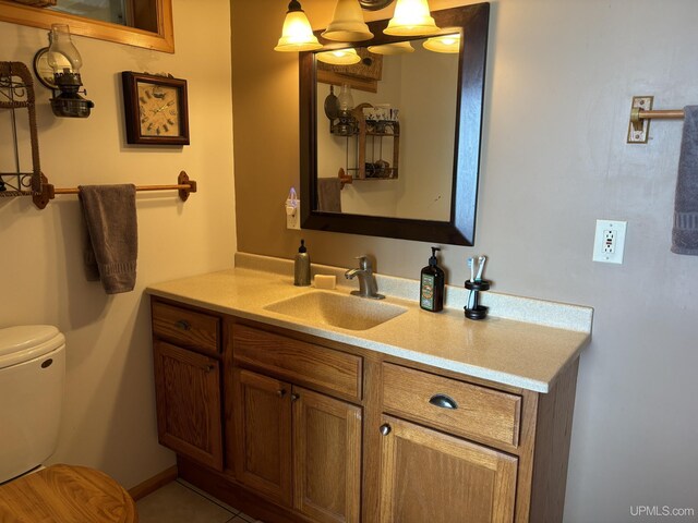 14998 N Superior Rd, Houghton, MI 49931 - half bathroom featuring vanity, toilet, and a chandelier