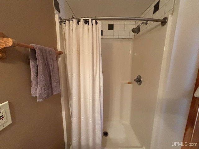 bathroom with a shower with curtain