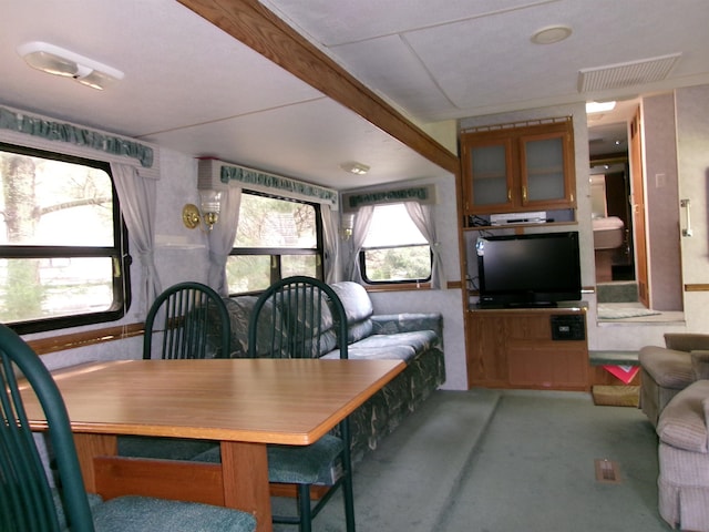 dining room with carpet floors and visible vents