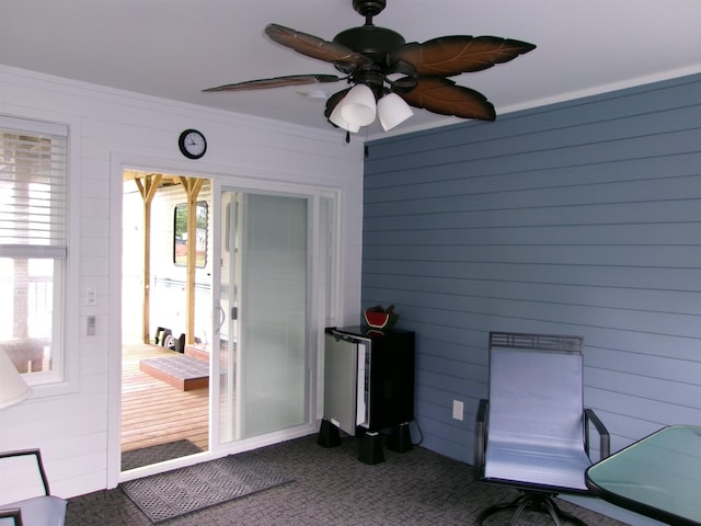 exterior space featuring ceiling fan