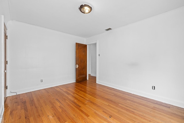 unfurnished room with light hardwood / wood-style flooring