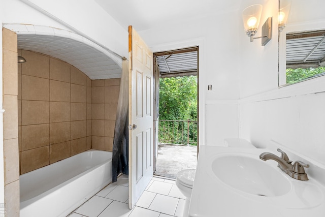 full bathroom featuring toilet, vanity, shower / tub combo with curtain, and tile patterned floors